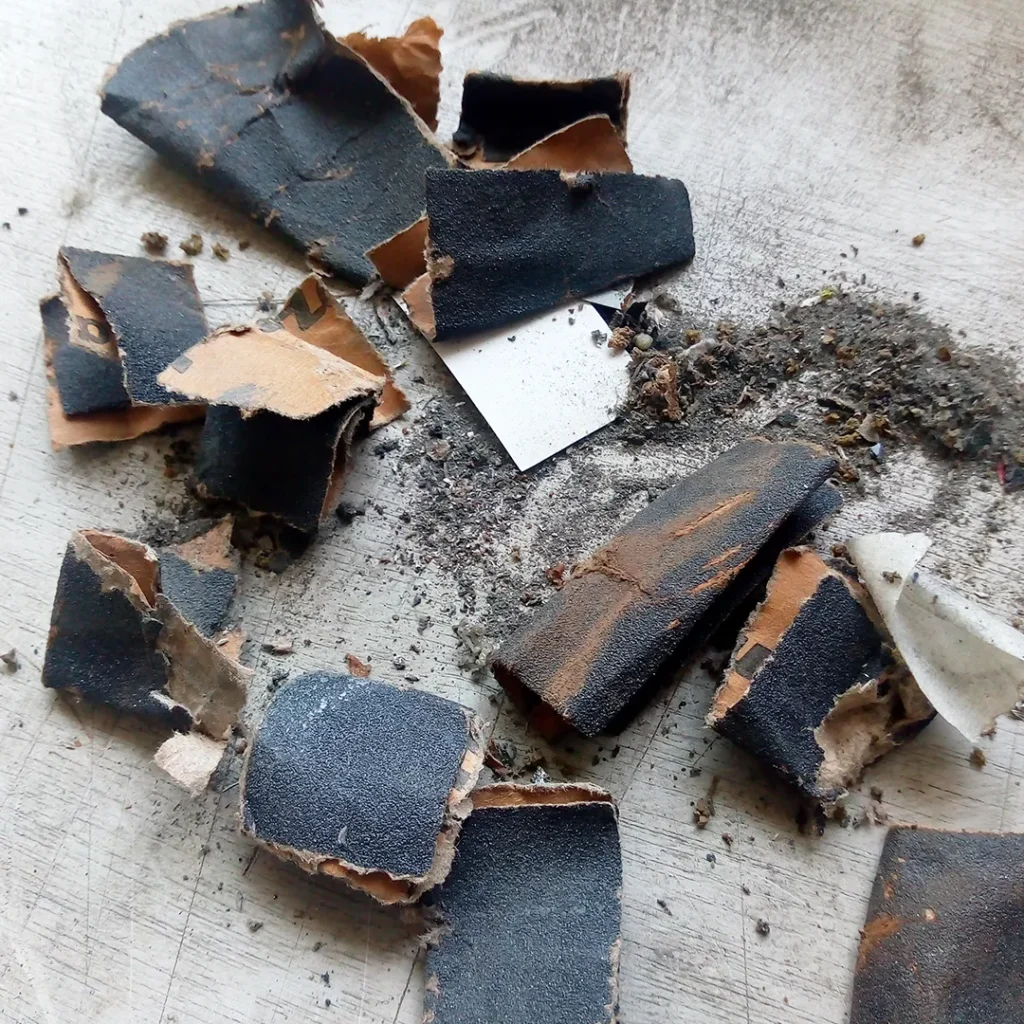 Residual dust and debris from the speaker basket after cleaning