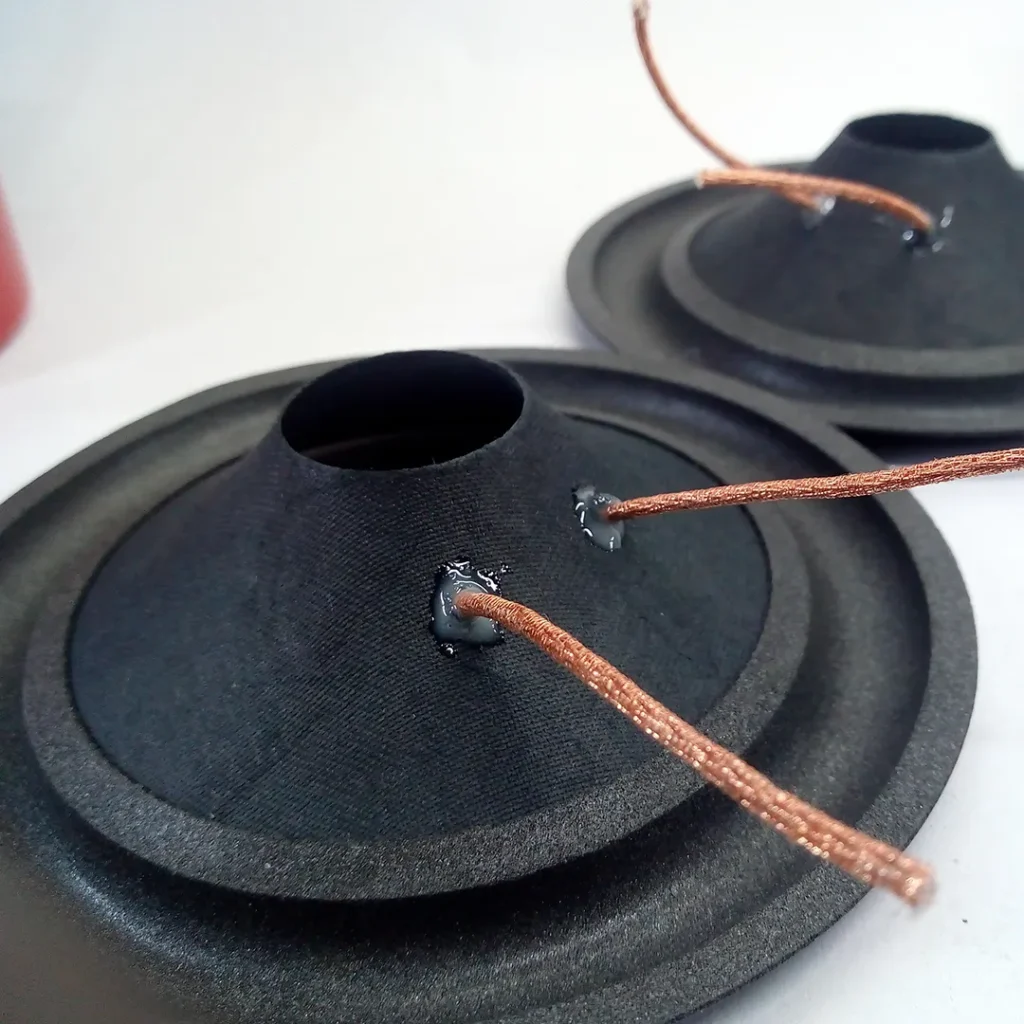 Attaching the voice coil connection wire (braid)